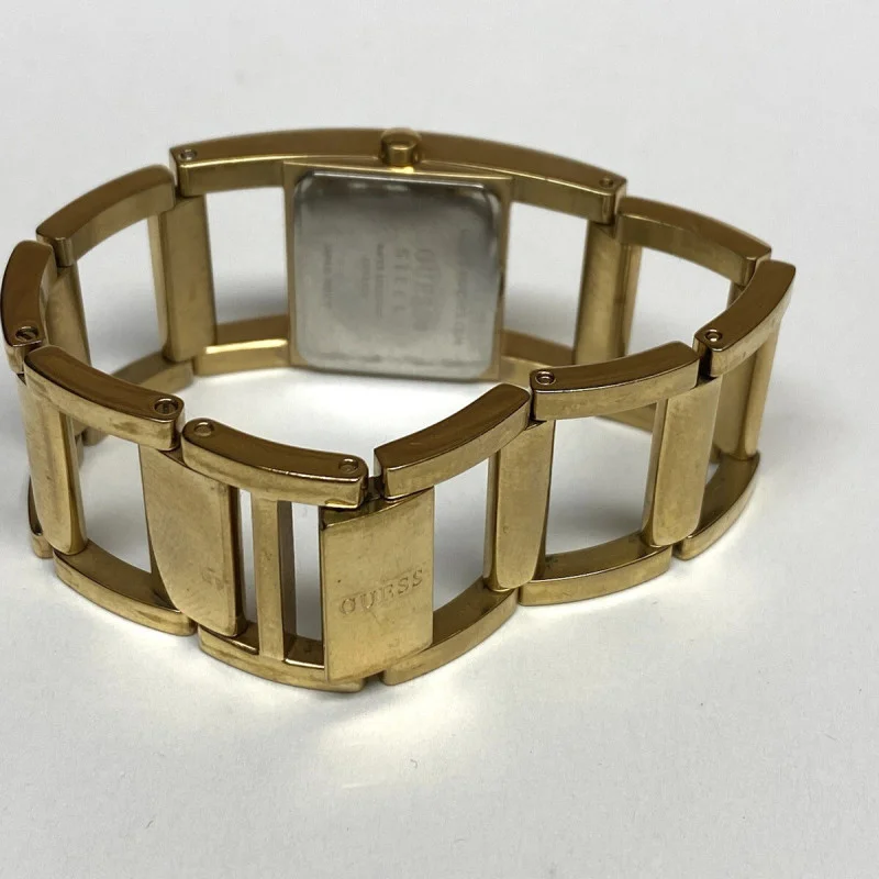 GUESS GOLD TONE WATCH GUESS STEEL WATER RESISTANT JAPAN MOVT