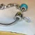 Judith Ripka Silver 925 CZ Charms Bracelet Size 7.5” Long, 7 pieces, Pouch, Box