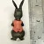BUNNY FIGURINES SET ONE HAS FLOWERS IN HAND