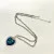 Heart-Shaped Blue Glass Pendant Necklace with Silver-Tone Chain - Elegant Design