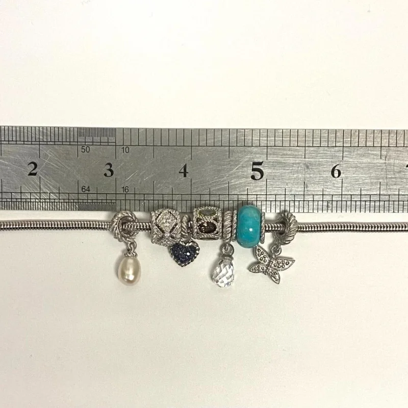 Judith Ripka Silver 925 CZ Charms Bracelet Size 7.5” Long, 7 pieces, Pouch, Box