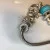 Judith Ripka Silver 925 CZ Charms Bracelet Size 7.5” Long, 7 pieces, Pouch, Box