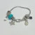 Judith Ripka Silver 925 CZ Charms Bracelet Size 7.5” Long, 7 pieces, Pouch, Box