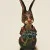 BUNNY FIGURINES SET ONE HAS FLOWERS IN HAND