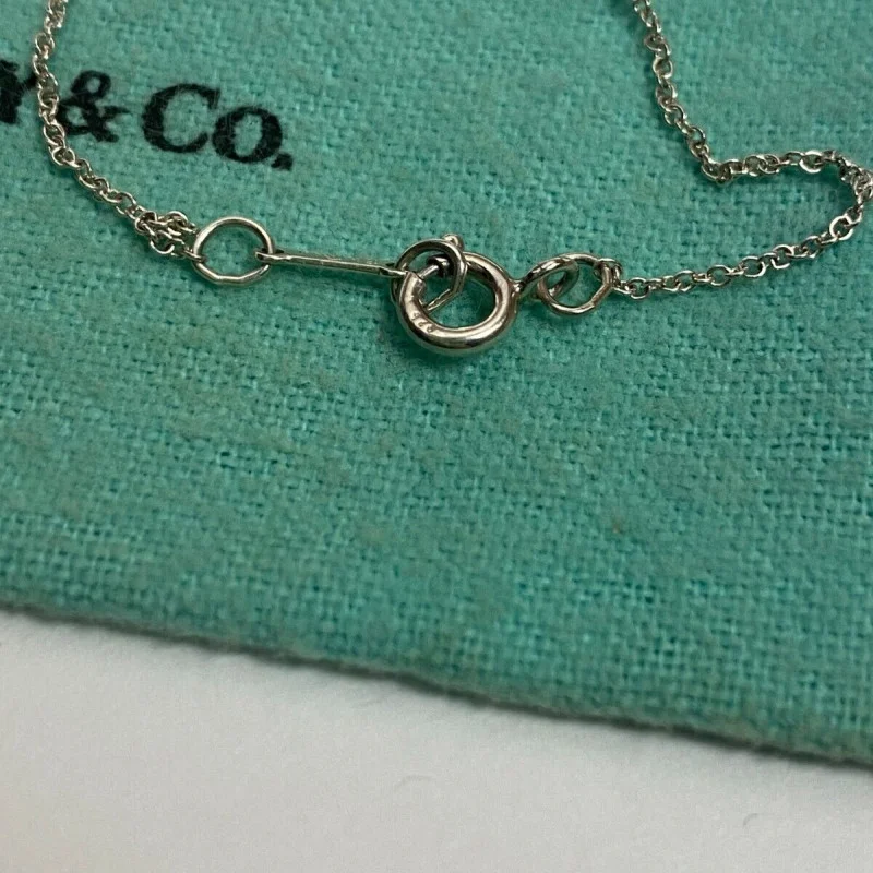Tiffany & Co. Paloma Picasso Top Cross Kiss Necklace Silver 925