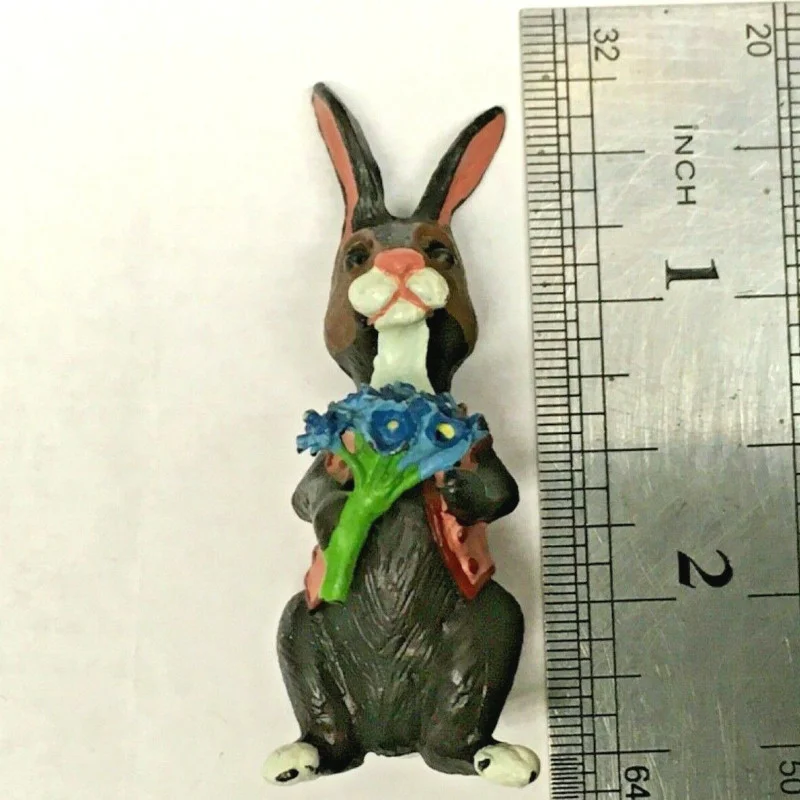 BUNNY FIGURINES SET ONE HAS FLOWERS IN HAND