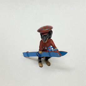 1 3/4 LONG DOGGY WITH RED HAT , RED SWEATER WITH BLUE SKI DECOR FOR TABLE