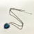 Heart-Shaped Blue Glass Pendant Necklace with Silver-Tone Chain - Elegant Design Heart-Shaped Blue Glass Pendant Necklace with Silver-Tone Chain - Elegant Design