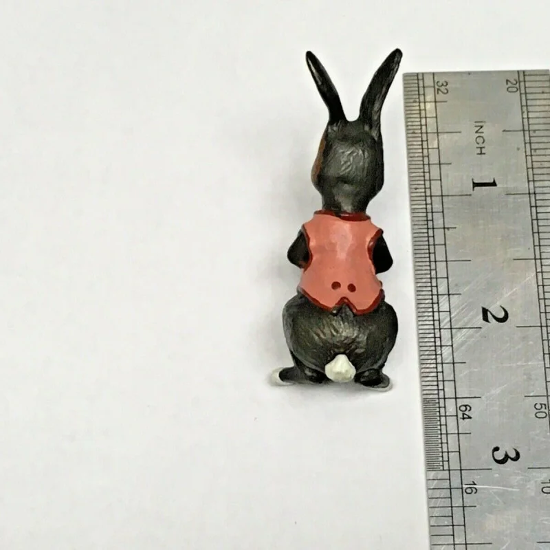 BUNNY FIGURINES SET ONE HAS FLOWERS IN HAND
