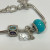 Judith Ripka Silver 925 CZ Charms Bracelet Size 7.5” Long, 7 pieces, Pouch, Box Judith Ripka Silver 925 CZ Charms Bracelet Size 7.5” Long, 7 pieces, Pouch, Box