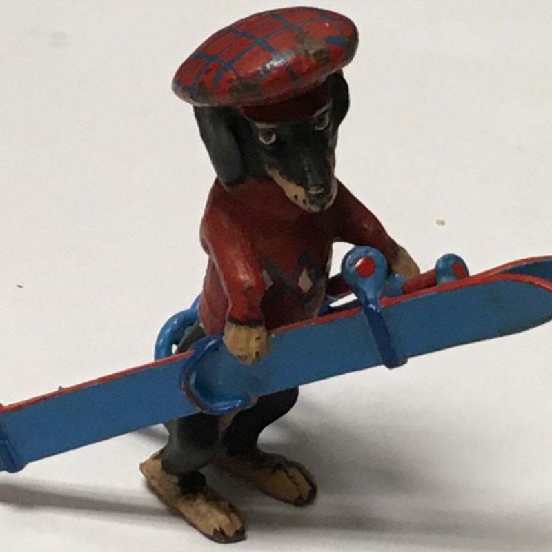 1 3/4 LONG DOGGY WITH RED HAT , RED SWEATER WITH BLUE SKI DECOR FOR TABLE 1 3/4 LONG DOGGY WITH RED HAT , RED SWEATER WITH BLUE SKI DECOR FOR TABLE