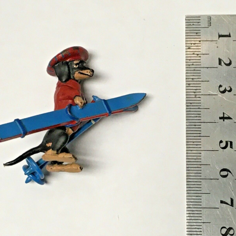 1 3/4 LONG DOGGY WITH RED HAT , RED SWEATER WITH BLUE SKI DECOR FOR TABLE 1 3/4 LONG DOGGY WITH RED HAT , RED SWEATER WITH BLUE SKI DECOR FOR TABLE