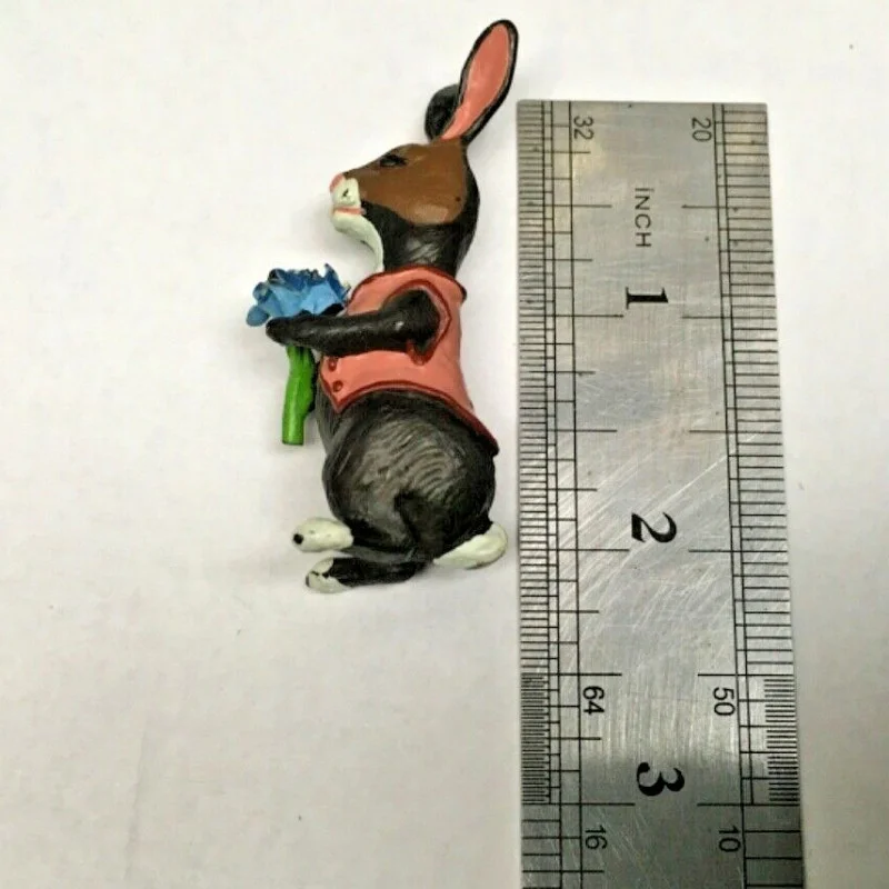 BUNNY FIGURINES SET ONE HAS FLOWERS IN HAND