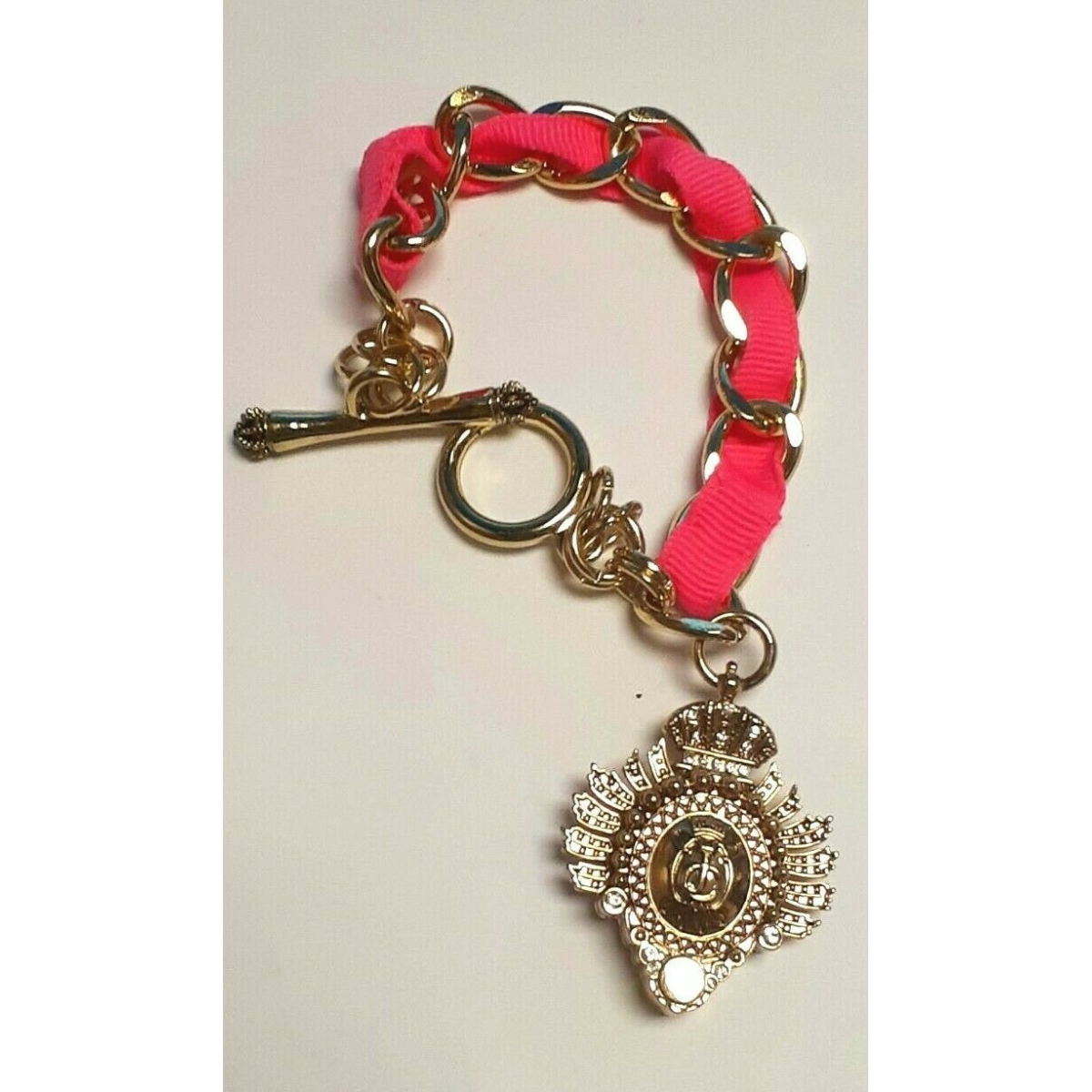 Juicy Couture Gold Tone Link With Charm Pink Lace Bracelet