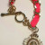 Juicy Couture Gold Tone Link With Charm Pink Lace Bracelet