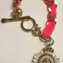 Juicy Couture Gold Tone Link With Charm Pink Lace Bracelet