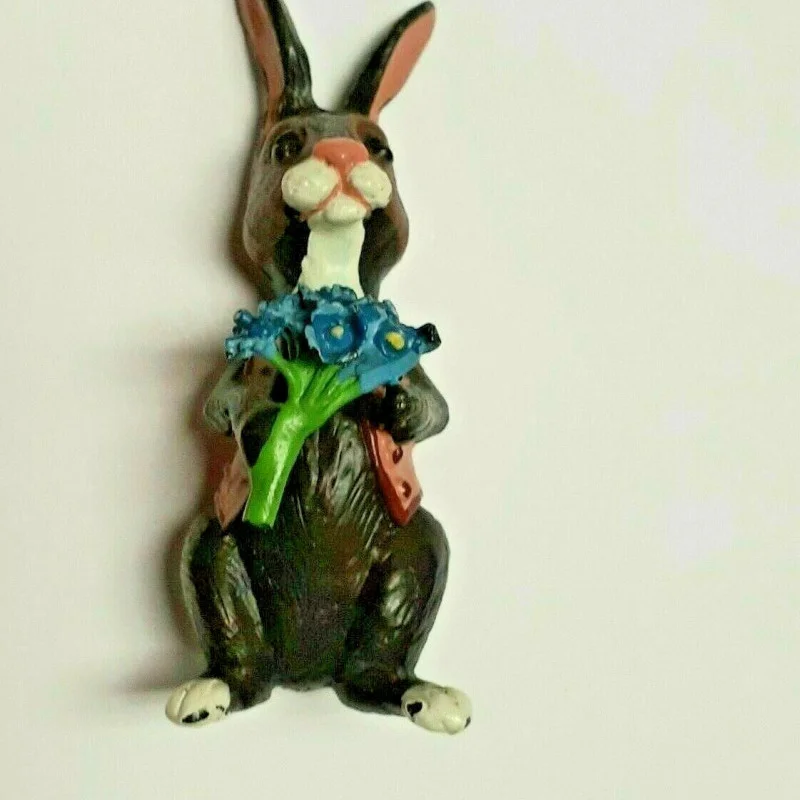 BUNNY FIGURINES SET ONE HAS FLOWERS IN HAND