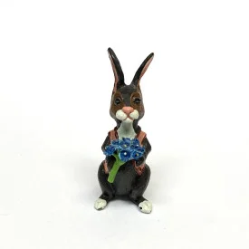 BUNNY FIGURINES SET ONE HAS FLOWERS IN HAND