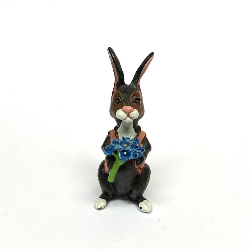 BUNNY FIGURINES SET ONE HAS FLOWERS IN HAND