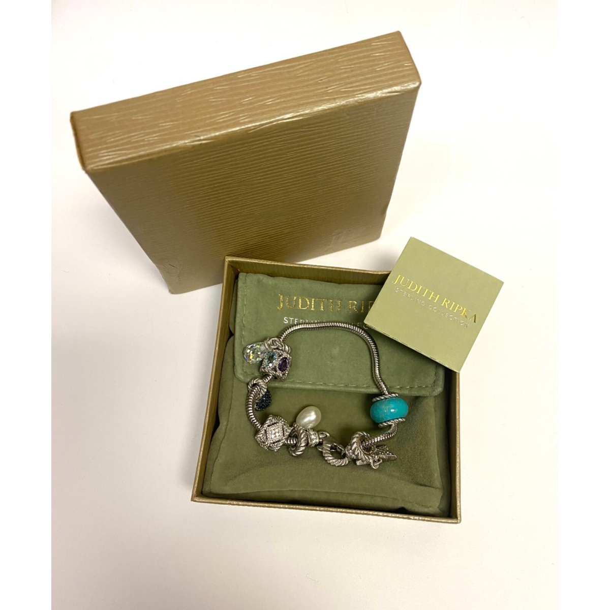 Judith Ripka Silver 925 CZ Charms Bracelet Size 7.5” Long, 7 pieces, Pouch, Box