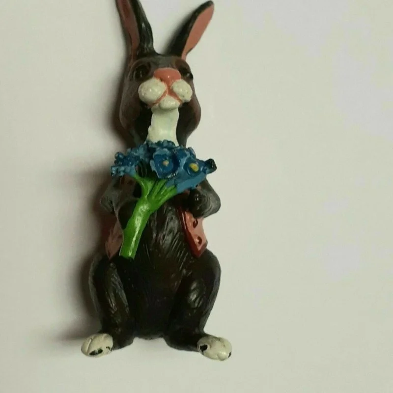 BUNNY FIGURINES SET ONE HAS FLOWERS IN HAND