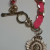 Juicy Couture Gold Tone Link With Charm Pink Lace Bracelet
