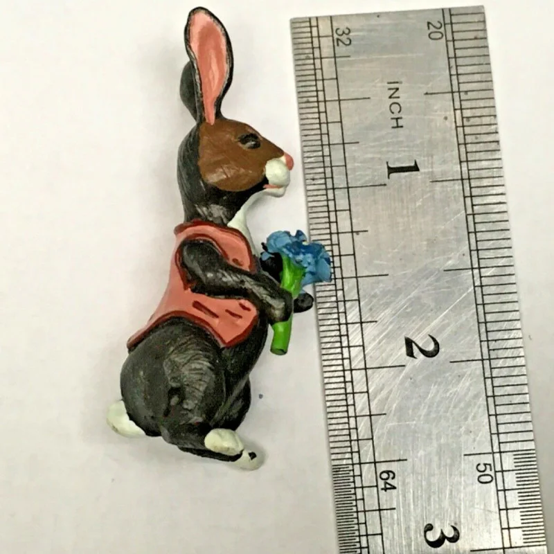 BUNNY FIGURINES SET ONE HAS FLOWERS IN HAND